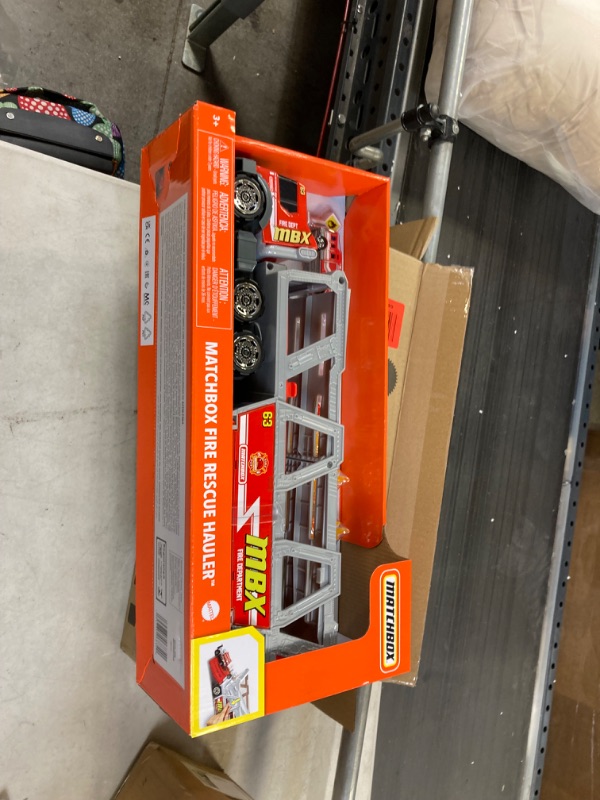 Photo 3 of ?Matchbox Fire Rescue Hauler Playset Themed Hauler with 1 Fire-Themed Vehicle, Holds 16 Cars, Easy-Release Ramp, 8 Accessories & Storage, for 3 & Up [Amazon Exclusive]