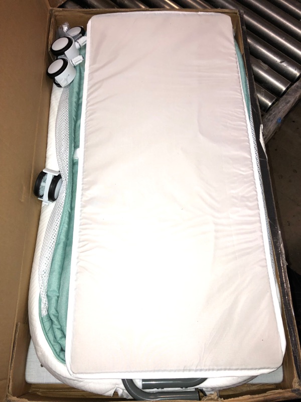 Photo 2 of Dream on Me Cub Portable Bassinet in Mint, Multi-Use Baby Bassinet with Locking Wheels, Large Storage Basket, Mattress Pad Included, JPMA Certified