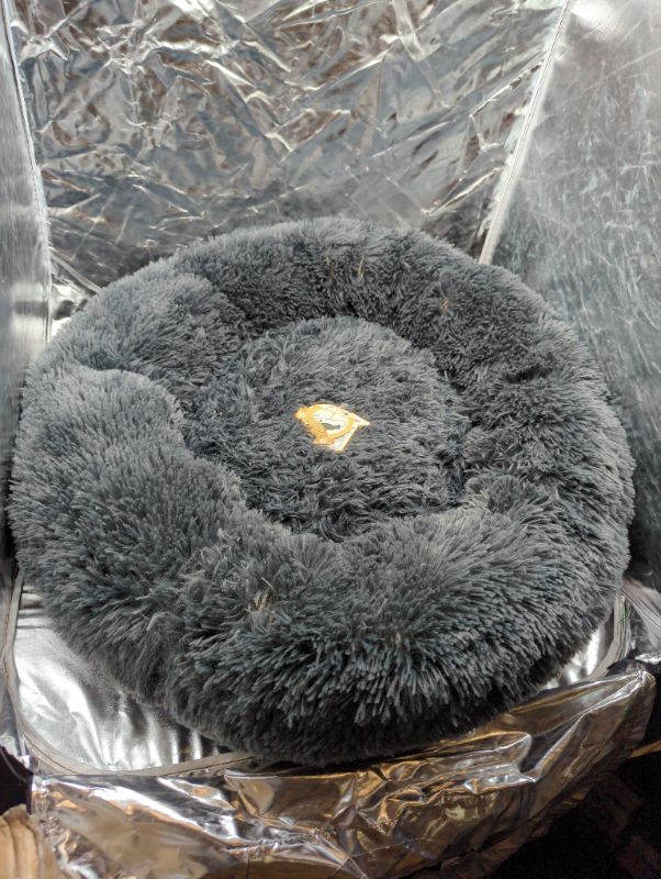 Photo 2 of NOYAL Calming Dog Bed Donut Anti Anxiety Fluffy Dog Bed for Small Medium Dog and Cat
