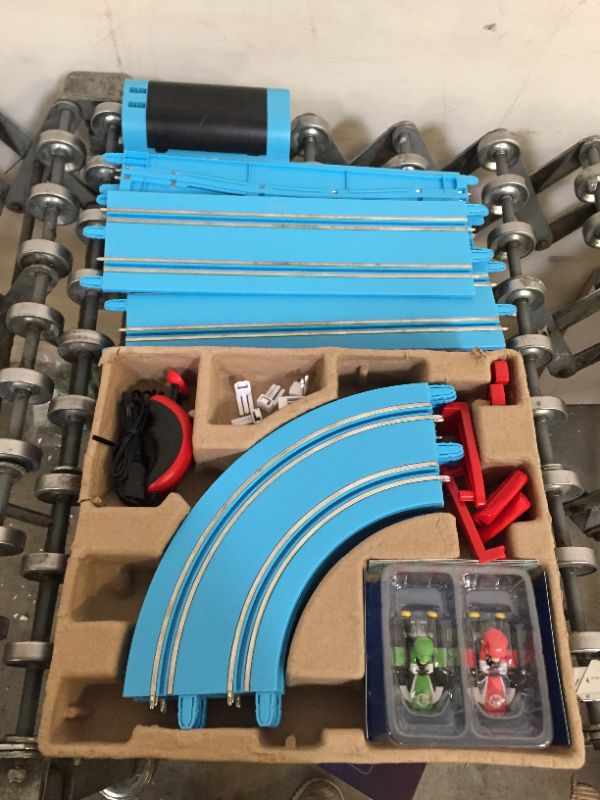 Photo 2 of Carrera First Nintendo Mario Kart Slot Car Race Track - Includes 2 Cars: Mario and Luigi and Two-Controllers - Battery-Powered Beginner Set for Kids Ages 3 Years and Up, 20063028 Mario Kart / Flippers