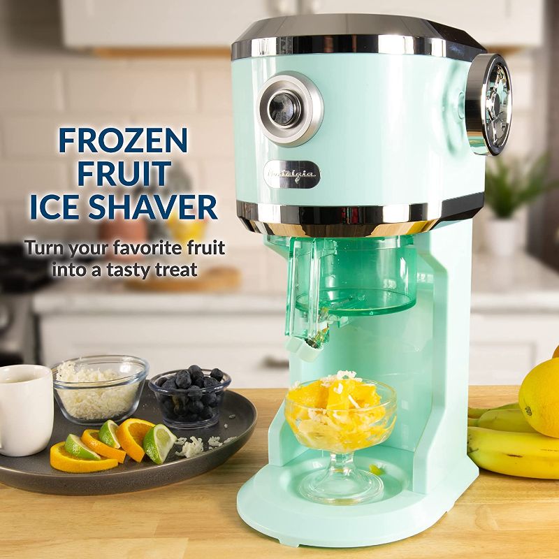 Photo 1 of Nostalgia Retro Electric Table-Top Snow Cone Maker, Vintage Shaved Ice Machine Includes 2 Molds, Aqua
