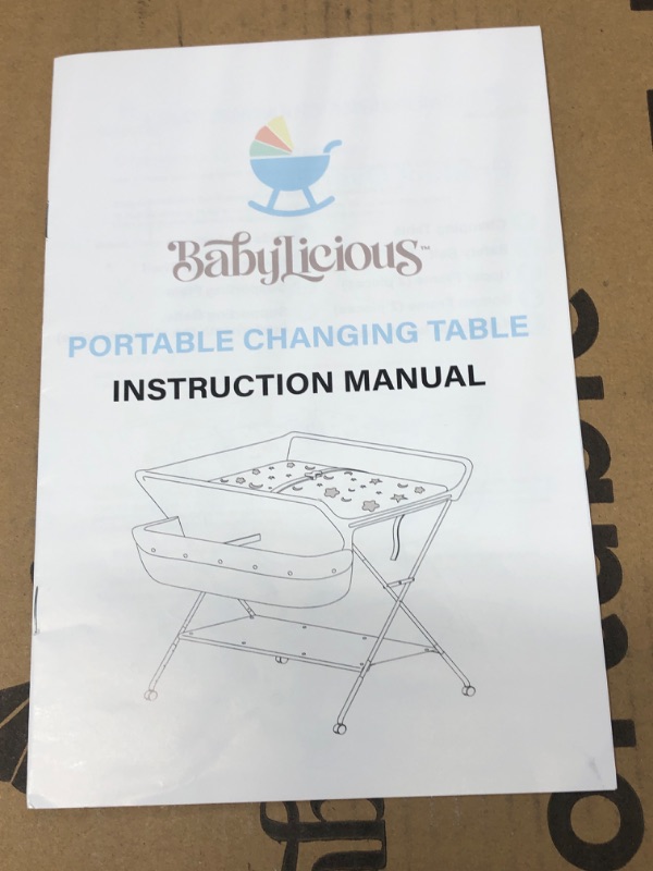 Photo 1 of Babylicious Baby Portable Changing Table - Foldable Changing Table with Wheels - Portable Diaper Changing Station - Adjustable Height Baby Changing Table-Safety Belt and Large Storage Rack for Infants
