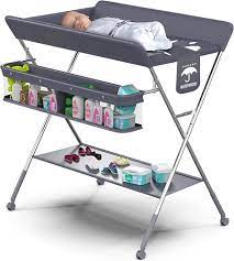 Photo 1 of Babylicious Baby Portable Changing Table - Foldable Changing Table with Wheels - Portable Diaper Changing Station - Adjustable Height Baby Changing Table-Safety Belt and Large Storage Rack for Infants
