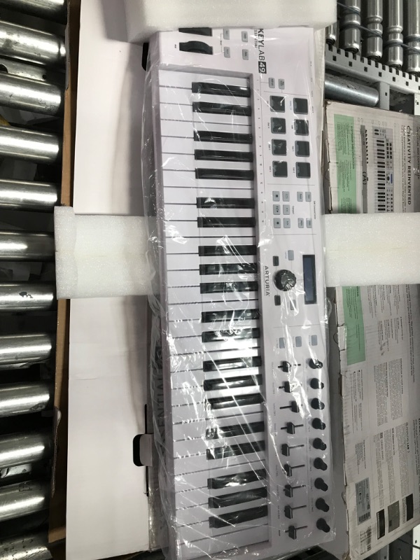 Photo 2 of Arturia KeyLab Essential 49 - 49 Key USB MIDI Keyboard Controller with Velocity Sensitive Synth Action Keys, 8 Drum Pads, 9 Faders, 9 Knobs and Analog Lab V Software Included
