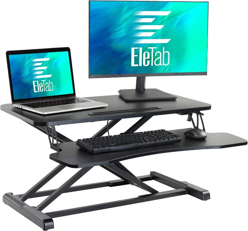 Photo 1 of EleTab Standing Desk Converter Sit Stand Desk Riser Stand up Desk Tabletop Workstation fits Dual Monitor 32 inches Black
