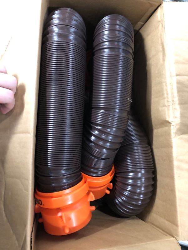 Photo 2 of Camco 20' (39742) RhinoFLEX 20-Foot RV Sewer Hose Kit, Swivel Transparent Elbow with 4-in-1 Dump Station Fitting-Storage Caps Included , Black , Brown 20ft Sewer Hose Kit Frustration-Free Packaging