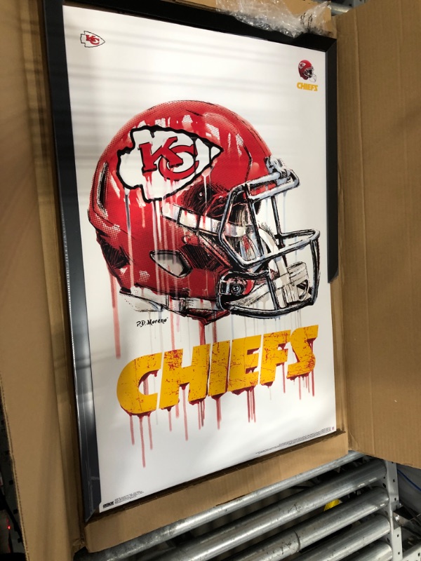 Photo 2 of ***Pieces of the frame are broken and missing, see pictures.***
Trends International NFL Kansas City Chiefs - Drip Helmet 20 Wall Poster, 22.375" x 34", Black Framed Version 22.375" x 34" Black Framed Version