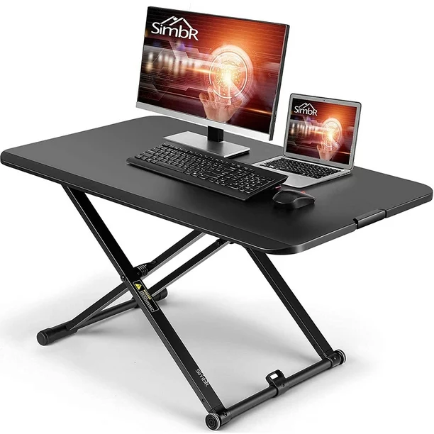 Photo 1 of SIMBR Standing Desk Converter, 30" Ultra-Thin Height Adjustable Stand Up Desk Converter Gas Spring Desk Riser Converter Sit to Stand in Seconds Computer Desk for Home and Office
