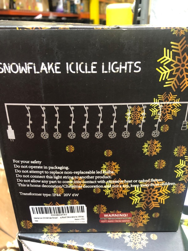 Photo 2 of weillsnow Snowflake Icicle Lights Outdoor, 100 LED 10 Drops Connectable 8 Twinkle Modes Waterproof Icicle Christmas Lights for Outdoor, Indoor, Eaves, Window, Christmas Decorations (White)