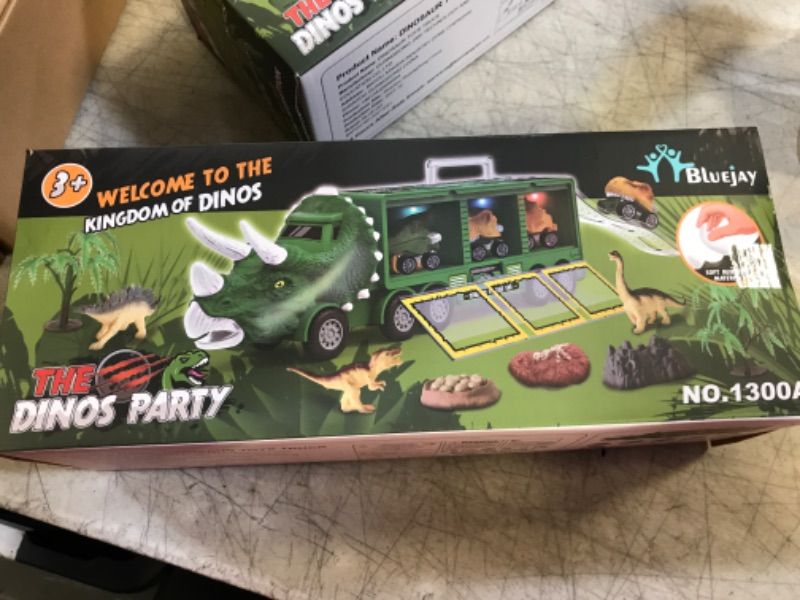 Photo 2 of BLUEJAY 21 Pack Dinosaur Toys for Kids 3-7, Dinosaur Truck with Oversized Dinosaur Map, Flashing Lights, Music and Roaring Sound, Kids Toys with 6 Pull Back Dinosaur Cars, 6 Dinosaur Toys (Green)