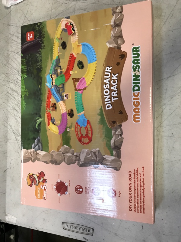 Photo 2 of MAGICDINOSAUR Slot Car Race Track Toys for Boys, 2 Electric Cars & 4 Inertial Dino Cars, Flexible Track Creates Dinosaur World Road for Kids 3-5, Dinosaur Train Set for Toddlers dino race track