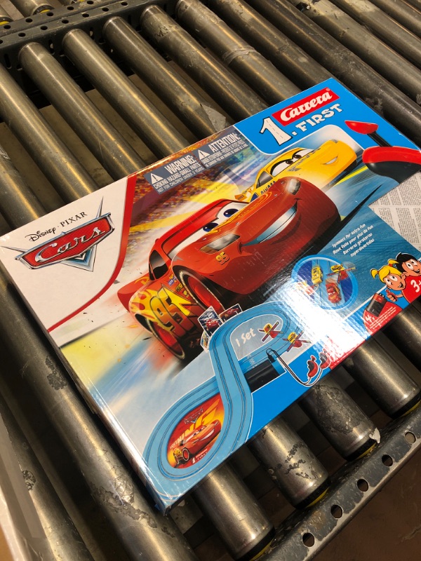 Photo 3 of Carrera First Disney/Pixar Cars - Slot Car Race Track - Includes 2 Cars: Lightning McQueen and Dinoco Cruz - Battery-Powered Beginner Racing Set for Kids Ages 3 Years and Up Disney Cars w/ Spinners