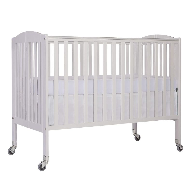 Photo 1 of Dream On Me Folding Full Size Convenience Crib In White, Two Adjustable Mattress Height Positions, Comes With Heavy Duty Locking Wheels, Flat Folding Crib
