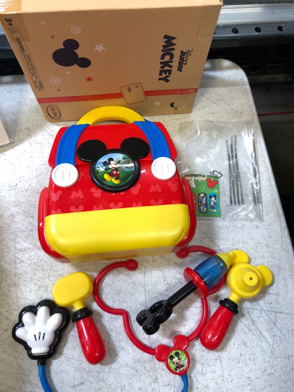 Photo 2 of Disney Junior Mickey Mouse Funhouse On the Go Doctor Bag, 8 Piece Pretend Play Set with Lights and Sounds Stethoscope, Amazon Exclusive, by Just Play