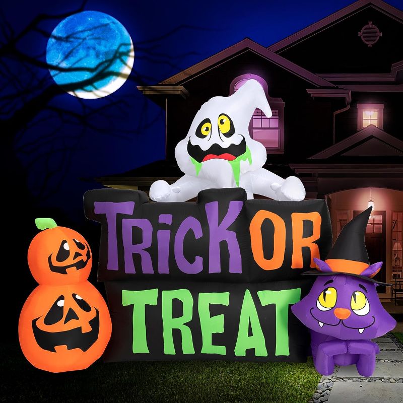 Photo 1 of  Halloween Inflatables Large 9 ft Trick or Treat Yard Sign - Inflatable Outdoor Halloween Decorations Blow Up Halloween Decorations for Yard, Lawn & Garden Internal Lights & Built-in Fan