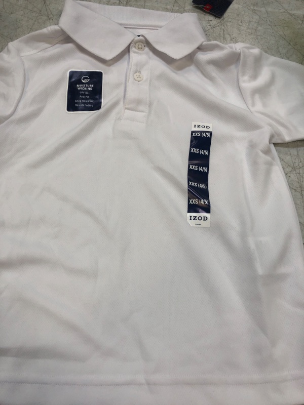 Photo 2 of IZOD Boys' School Uniform Sensory-Friendly Short Sleeve Polo Shirt, Button Closure, Tagless Inner Neckline , size xxs4/5