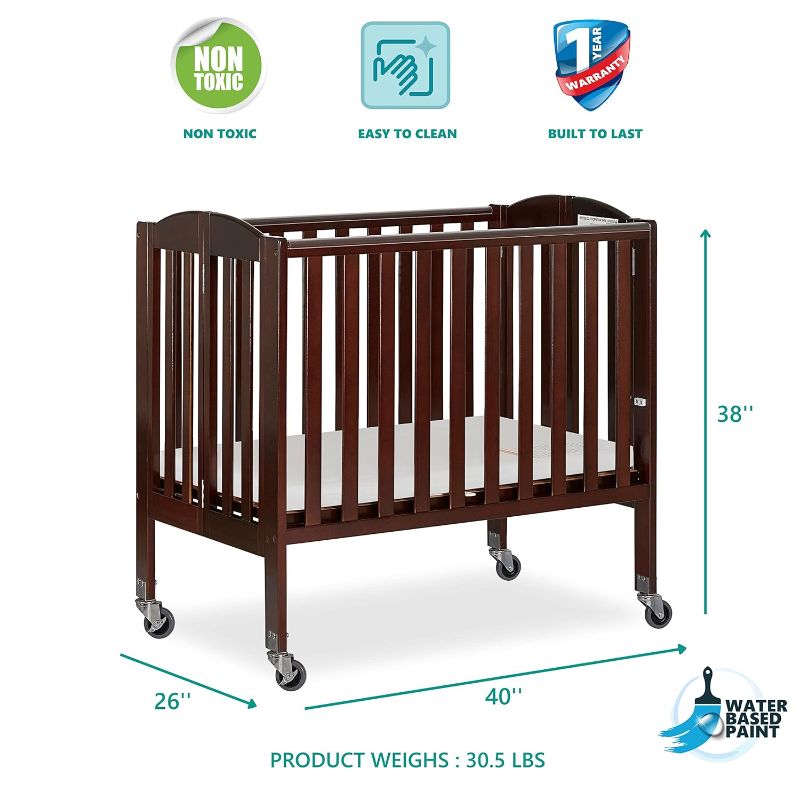 Photo 1 of **MISSING HARDWARE**
Dream On Me 2-in-1 Folding Portable Mini Crib, Natural