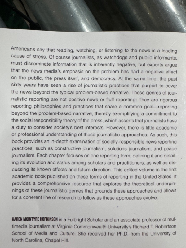 Photo 5 of "drinking distilled" and "reporting beyond the problem" books. 