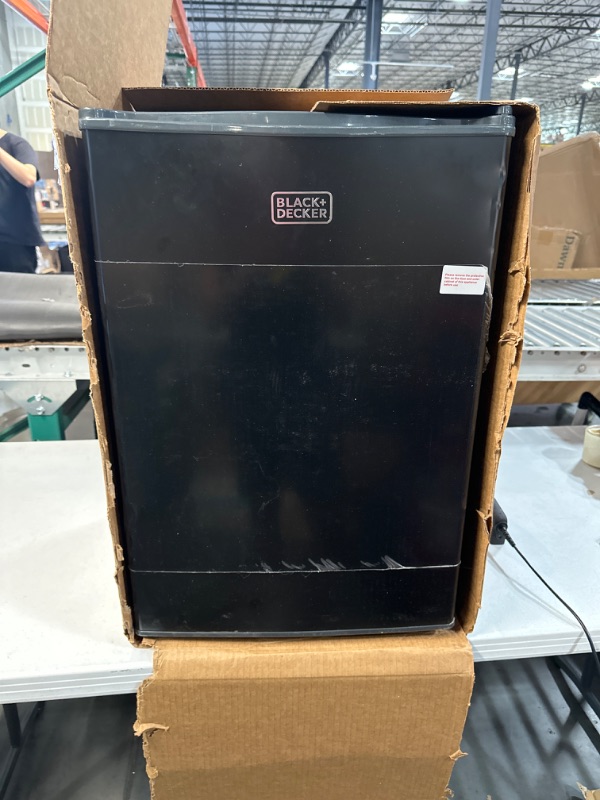 Photo 2 of * used * not functional * sold for parts/repair * 
BLACK+DECKER BCRK25B Compact Refrigerator Energy Star Single Door Mini Fridge with Freezer, 2.5 Cubic Feet, Black