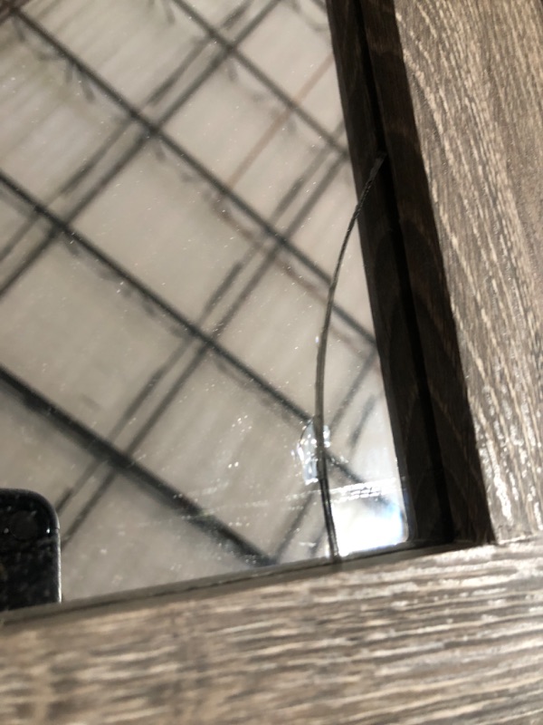 Photo 1 of **CORNER OF MIRROR IS CRACKED**
Style Selections Howell 20-in W x 28-in H Weathered Brown Rectangular Framed Bathroom Mirror