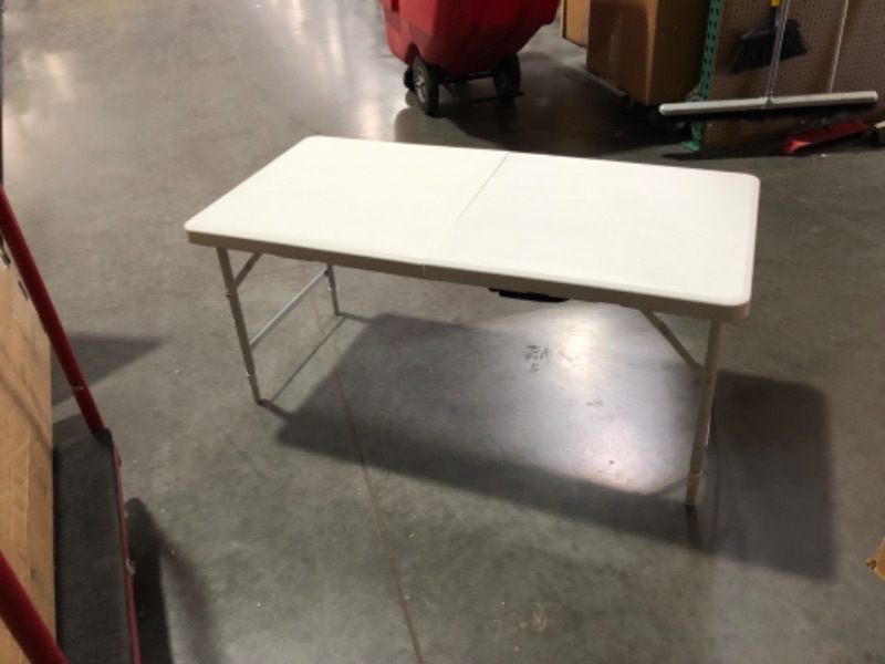 Photo 2 of ***ONE OF THE LEGS IS STUCK AND WON'T ADJUST VERTICALLY***
HaoKang Portable Folding Table 4ft Plastic Dining Table White