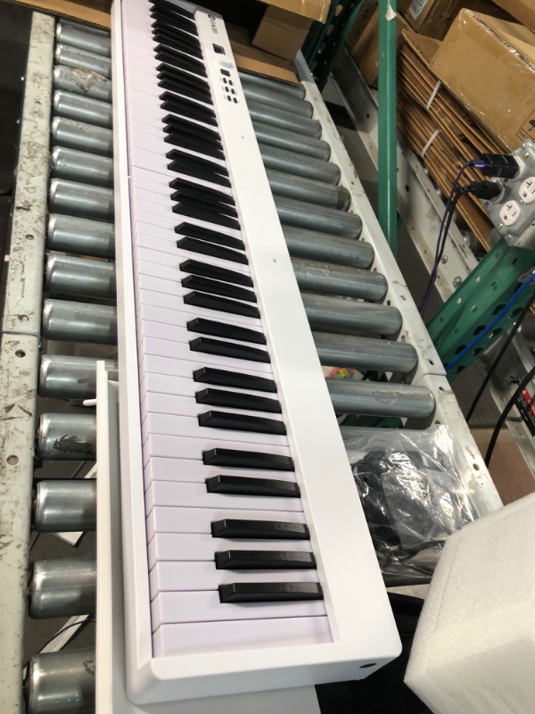 Photo 2 of USED - Folding Piano, Portable 88 Key Full Size Foldable Keyboard Piano Semi-Weighted Bluetooth with Light up Keys,  by Vangoa 88 Lighted Full Size Keys-Foldable White