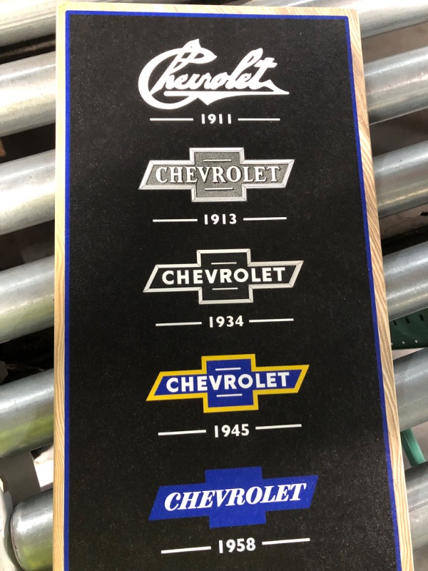 Photo 2 of Open Road Brands Chevrolet Logo Evolution Vertical Wood Wall Decor - Large Chevrolet Wall Art for Man Cave or Garage Black