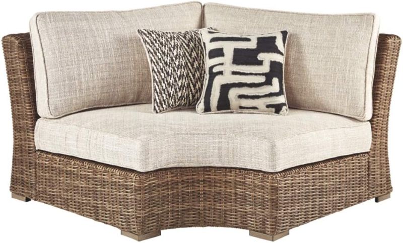 Photo 1 of *ALREADY ASSEMBLED*
Signature Design by Ashley Beachcroft Farmhouse Outdoor Patio Wicker Curved Corner Chair, Beige