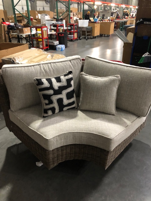 Photo 2 of *ALREADY ASSEMBLED*
Signature Design by Ashley Beachcroft Farmhouse Outdoor Patio Wicker Curved Corner Chair, Beige