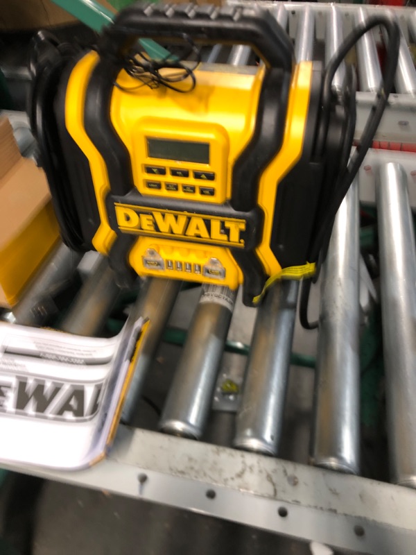 Photo 2 of DEWALT DXAEPS14 1600 Peak Battery Amp 12V Automotive Jump Starter/Power Station with 500 Watt AC Power Inverter, 120 PSI Digital Compressor, and USB Power , Yellow