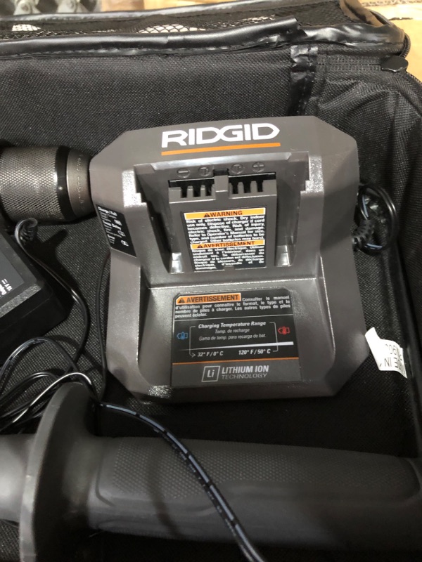 Photo 1 of * used item * missing battery 
RIDGID 18V Brushless Cordless 1/2 in. Hammer Drill/Driver Kit with 4.0 Ah MAX Output Battery, 18V Charger, and Tool Bag