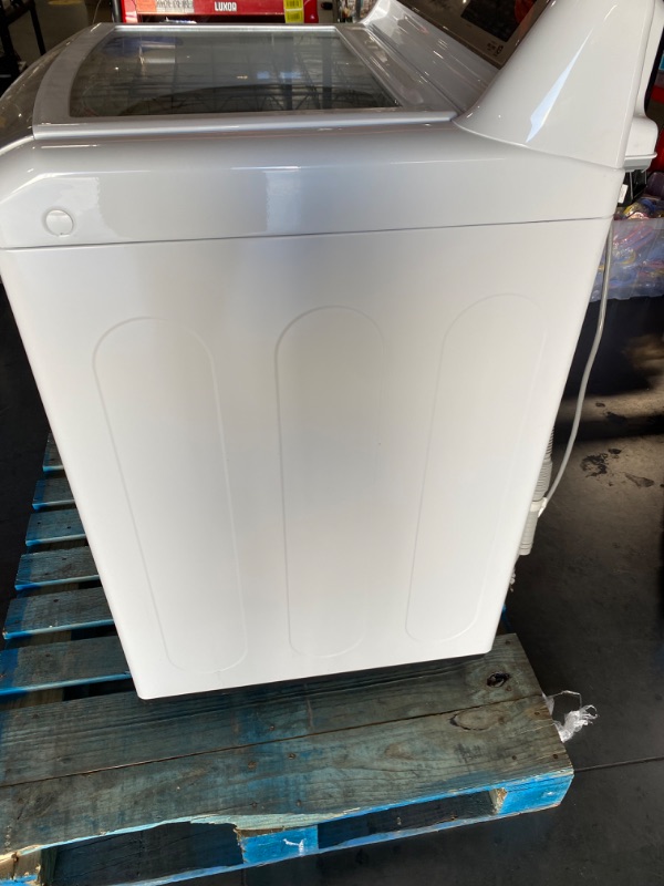 Photo 2 of **USED** **Powers On** 5.5 cu.ft. Mega Capacity Smart wi-fi Enabled Top Load Washer with TurboWash3D™ Technology
