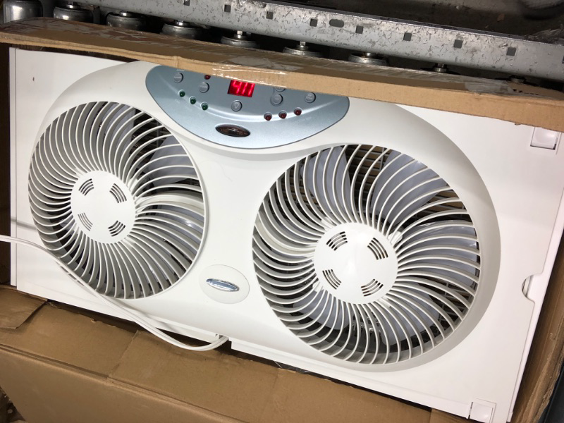 Photo 2 of * used * only one fan of 2 work * 
Bionaire Window Fan with Twin 8.5-Inch Reversible Airflow Blades and Remote Control