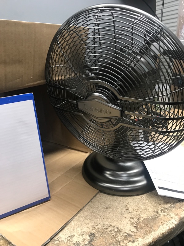 Photo 2 of Lasko 12" Classic Metal Table Fan - 12" Diameter - 3 Speed - Quiet, Carrying Handle, Oscillating - 17.3" Height x 13.3" Width - Metal