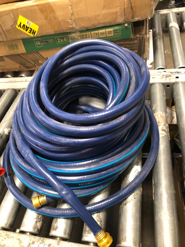 Photo 1 of **UNBRANDED BLUE GARDEN HOSE SIZE UNKNOWN