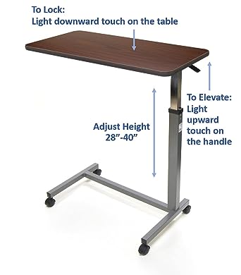 Photo 1 of Invacare Hospital Style Overbed Table with Auto-Touch Adjustable Height and Wheels, Fits Over Beds and Bedside, 6417 Black.75"H x 15"W x 30"L,Base: 15.5"W x 26"L,28" - 40"
