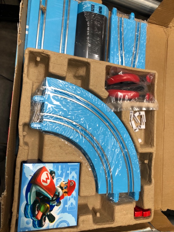 Photo 2 of Carrera First Nintendo Mario Kart Slot Car Race Track - Includes 2 Cars: Mario and Luigi and Two-Controllers - Battery-Powered Beginner Set for Kids Ages 3 Years and Up, 20063028 Mario Kart / Flippers