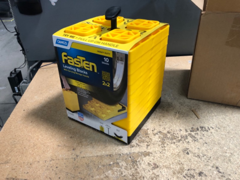 Photo 2 of Camco FasTen 2x2 RV Leveling Block For Single Tires, Interlocking Design Allows Stacking To Desired Height, Includes Secure T-Handle Carrying System, Yellow (Pack of 10) Yellow Single Tire Standard Packaging