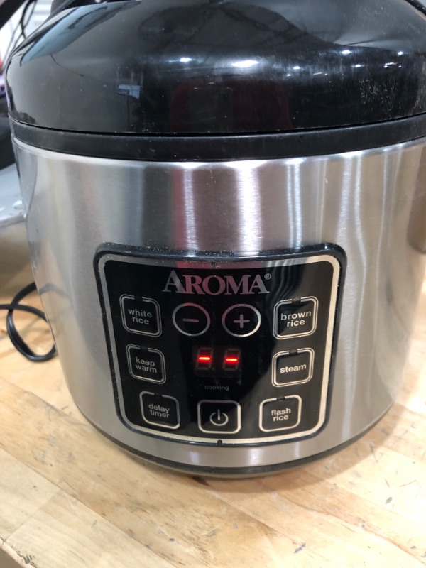 Photo 2 of ***USED DENTED*** TESTED FUNCTIONAL***

Aroma Housewares ARC-914SBD Digital Cool-Touch Rice Grain Cooker and Food Steamer, Stainless, Silver, 4-Cup (Uncooked) / 8-Cup (Cooked) Basic