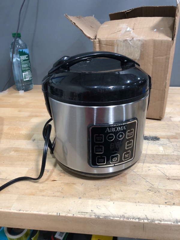 Photo 5 of ***USED DENTED*** TESTED FUNCTIONAL***

Aroma Housewares ARC-914SBD Digital Cool-Touch Rice Grain Cooker and Food Steamer, Stainless, Silver, 4-Cup (Uncooked) / 8-Cup (Cooked) Basic
