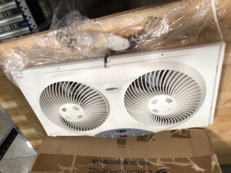 Photo 2 of ***PARTS ONLY NON FUNCTIONAL***

Bionaire Window Fan with Twin 8.5-Inch Reversible Airflow Blades and Remote Control, White White 2 Blades Electronic control with LCD screen Window Fan