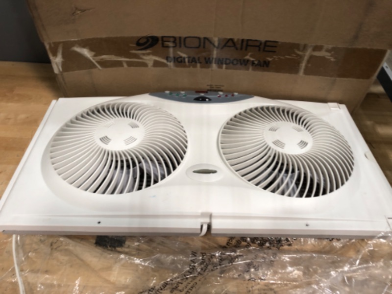 Photo 3 of ***PARTS ONLY NON FUNCTIONAL***

Bionaire Window Fan with Twin 8.5-Inch Reversible Airflow Blades and Remote Control, White White 2 Blades Electronic control with LCD screen Window Fan