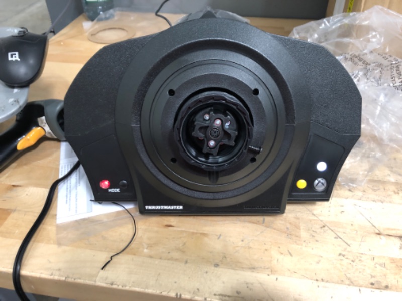 Photo 1 of ***DAMAGED SEE PHOTOS TAPPED PICTURE*** TESTED FUNCTIONAL***
Thrustmaster TX Servo Base (XBOX Series X/S, XOne & Windows) Black Thrusmaster TX Servo Base