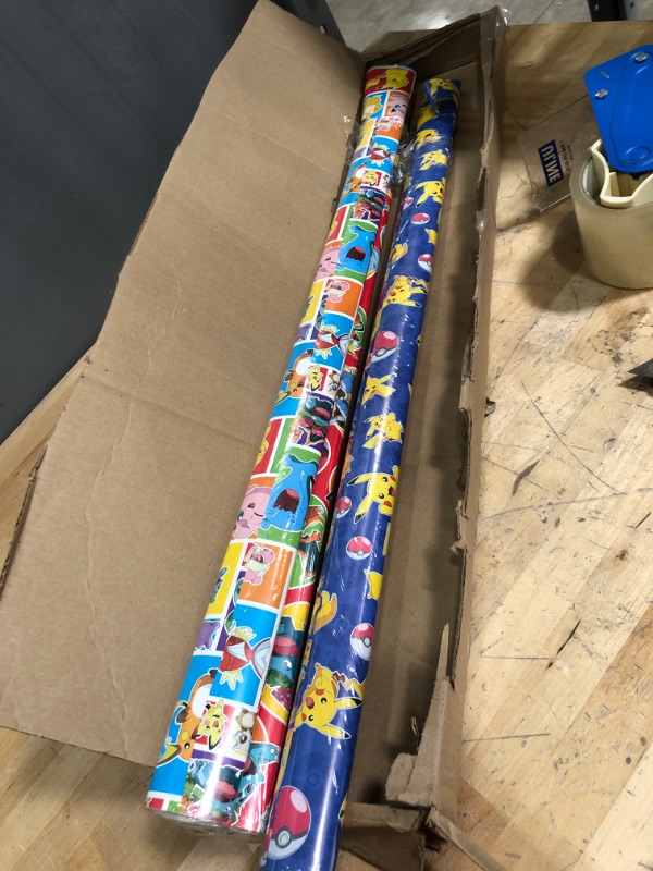 Photo 2 of ****SLIGHT TORN MINORLY CRUSHED, DAMAGE***
Hallmark Pokémon Wrapping Paper with Cutlines on Reverse (3 Rolls: 60 Sq. Ft. Ttl) with Pikachu, Charmander, Bulbasaur for Birthdays, Kids Parties, Gamers, Christmas Gifts