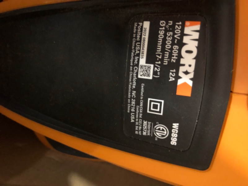 Photo 2 of ****USED *** ***OPEN BOX MAY BE MISSING HARDWARE*****

WORX WG896 12 Amp 7.5" Electric Lawn Edger & Trencher, 7.5in, Orange and Black & AmazonBasics 16/3 Vinyl Outdoor Extension Cord | Orange, 100-Foot