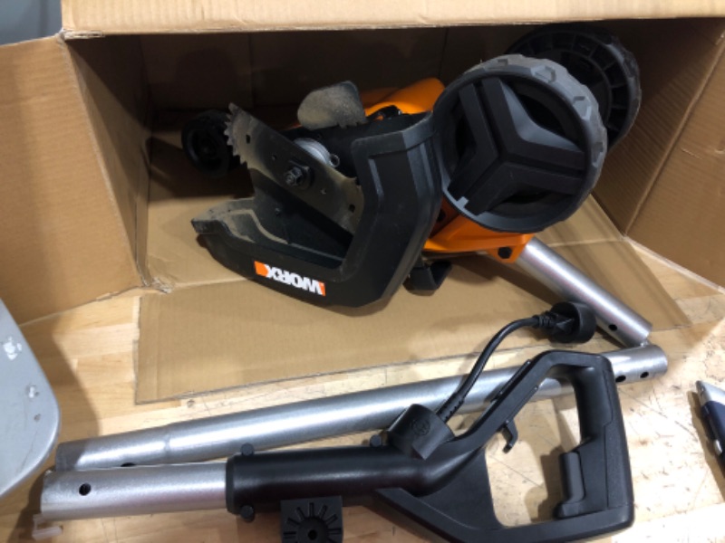 Photo 5 of ****USED *** ***OPEN BOX MAY BE MISSING HARDWARE*****

WORX WG896 12 Amp 7.5" Electric Lawn Edger & Trencher, 7.5in, Orange and Black & AmazonBasics 16/3 Vinyl Outdoor Extension Cord | Orange, 100-Foot