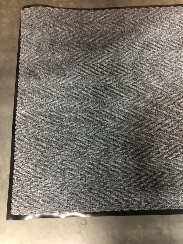 Photo 3 of (Used) 4.1 x  3 ft, dark grey, heavy duty outdoor mat.