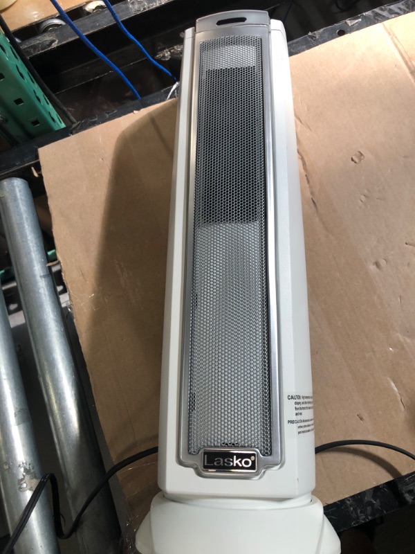 Photo 1 of **USED- TURNS ON**
Lasko Oscillating Ceramic Tower Space Heater  Silver 5775
