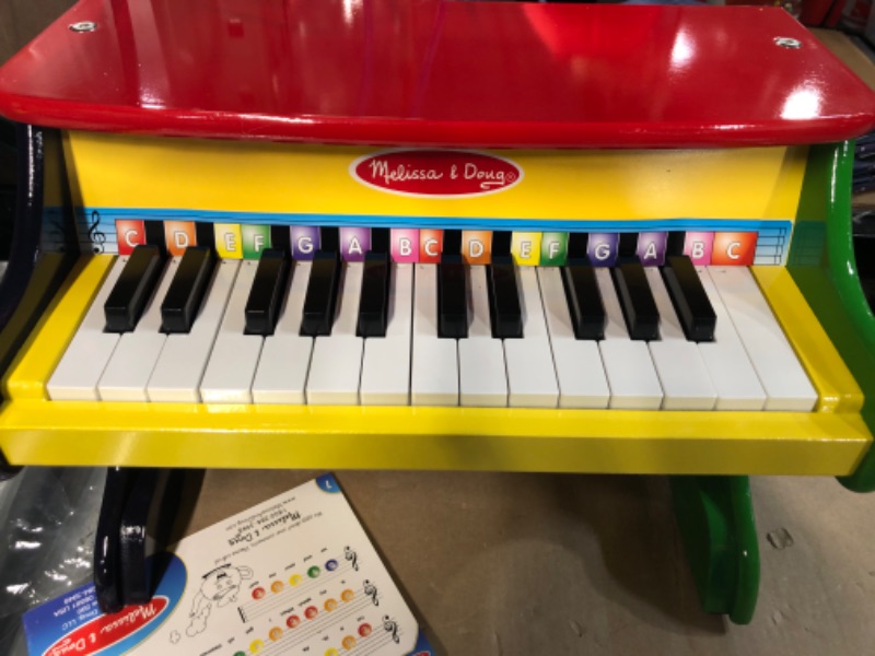 Photo 2 of **NEW OPEN FOR INSPECTION**
Melissa & Doug Learn-To-Play Piano With 25 Keys and Color-Coded Songbook - Toy Piano For Baby, Kids Piano Toy, Toddler Piano Toys For Ages 3+