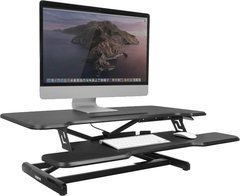 Photo 1 of Mount-It! Height Adjustable Stand Up Desk Converter, 36” Wide Tabletop Standing Desk Riser with Gas Spring Desktop Standing Desk with Keyboard Tray Fits Two Monitors, Black